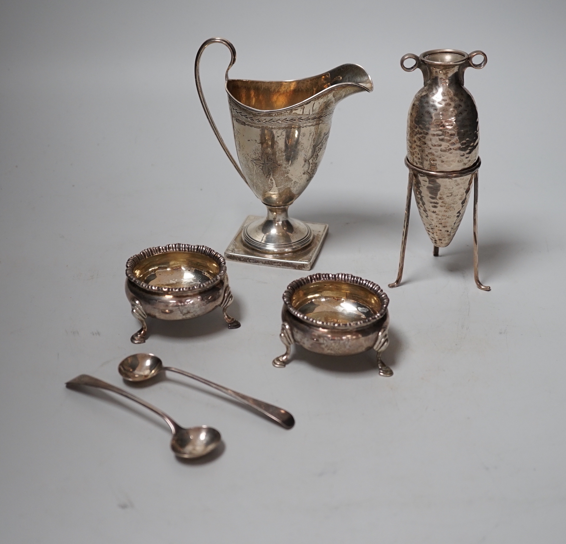 A pair of George III silver salts, London, 1778 and two later spoons, an Edwardian silver cream jug and a 925 specimen vase on stand.